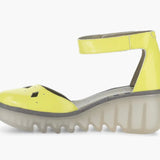 Yellow wedge with clear sole and velcro strap inner view