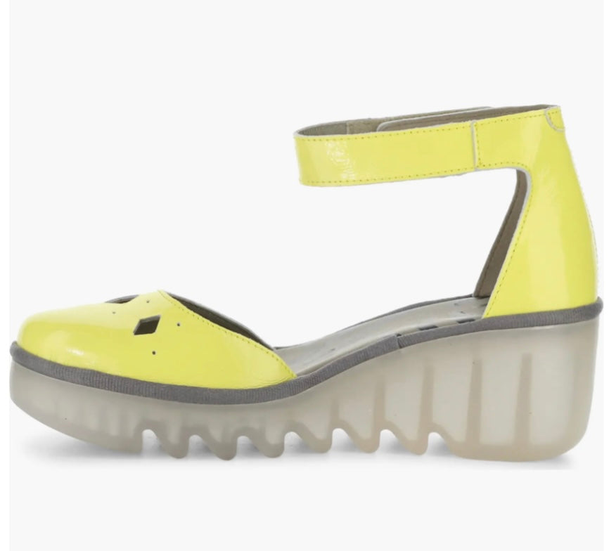Yellow wedge with clear sole and velcro strap inner view
