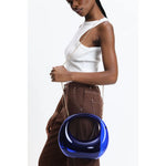 Transparent blue circular acrylic handbag with a gold chain strap model 3