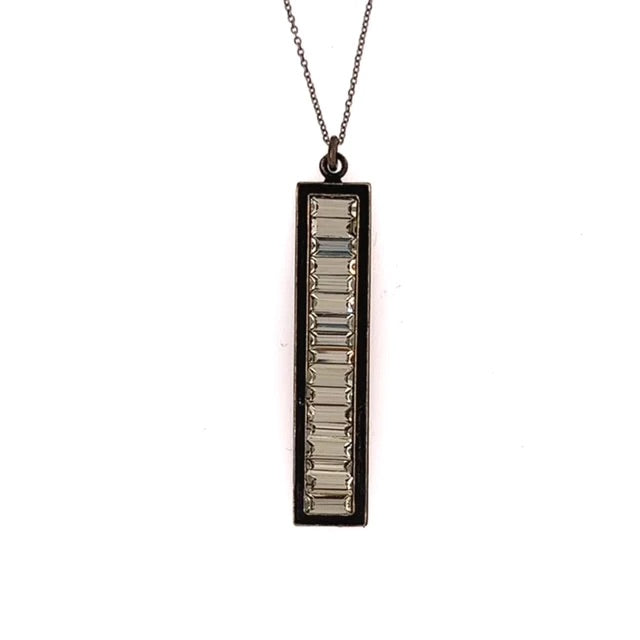 rectangular baguette crystal necklace features an antique brass finish with Swarovski crystals on a 16" brass chain with lobster clasp closure. Handcrafted in Brooklyn.