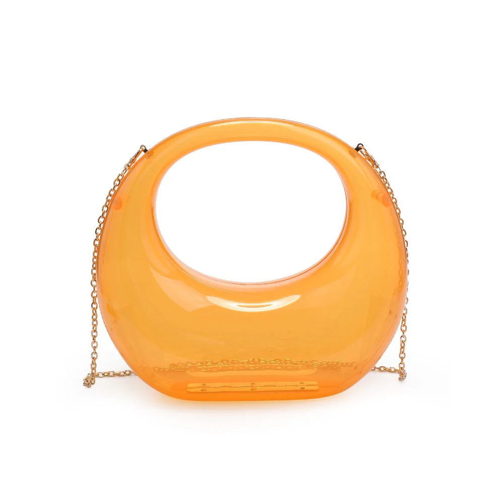 Transparent orange circular acrylic handbag with a gold chain strap close-up