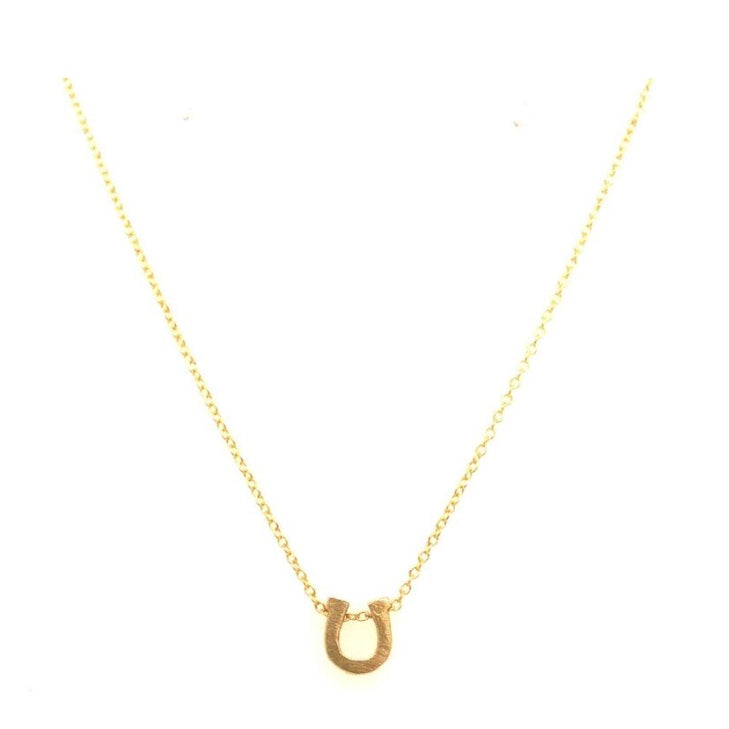 mini horseshoe pendant necklace features 18K gold plating on a fine chain. Handmade in New York.