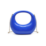 Blue circular acrylic handbag with a gold chain strap