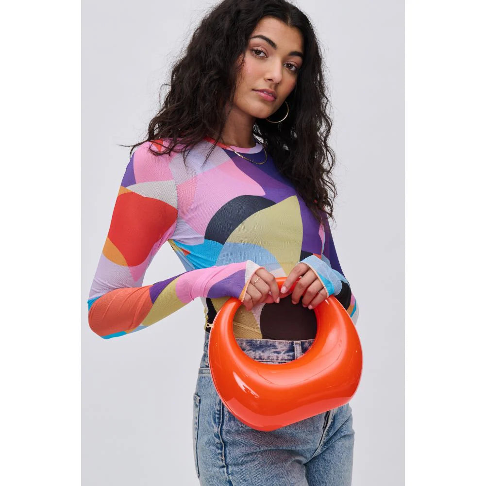 Orange circular acrylic handbag with a gold chain strap model 2