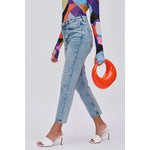 Orange circular acrylic handbag with a gold chain strap model 3