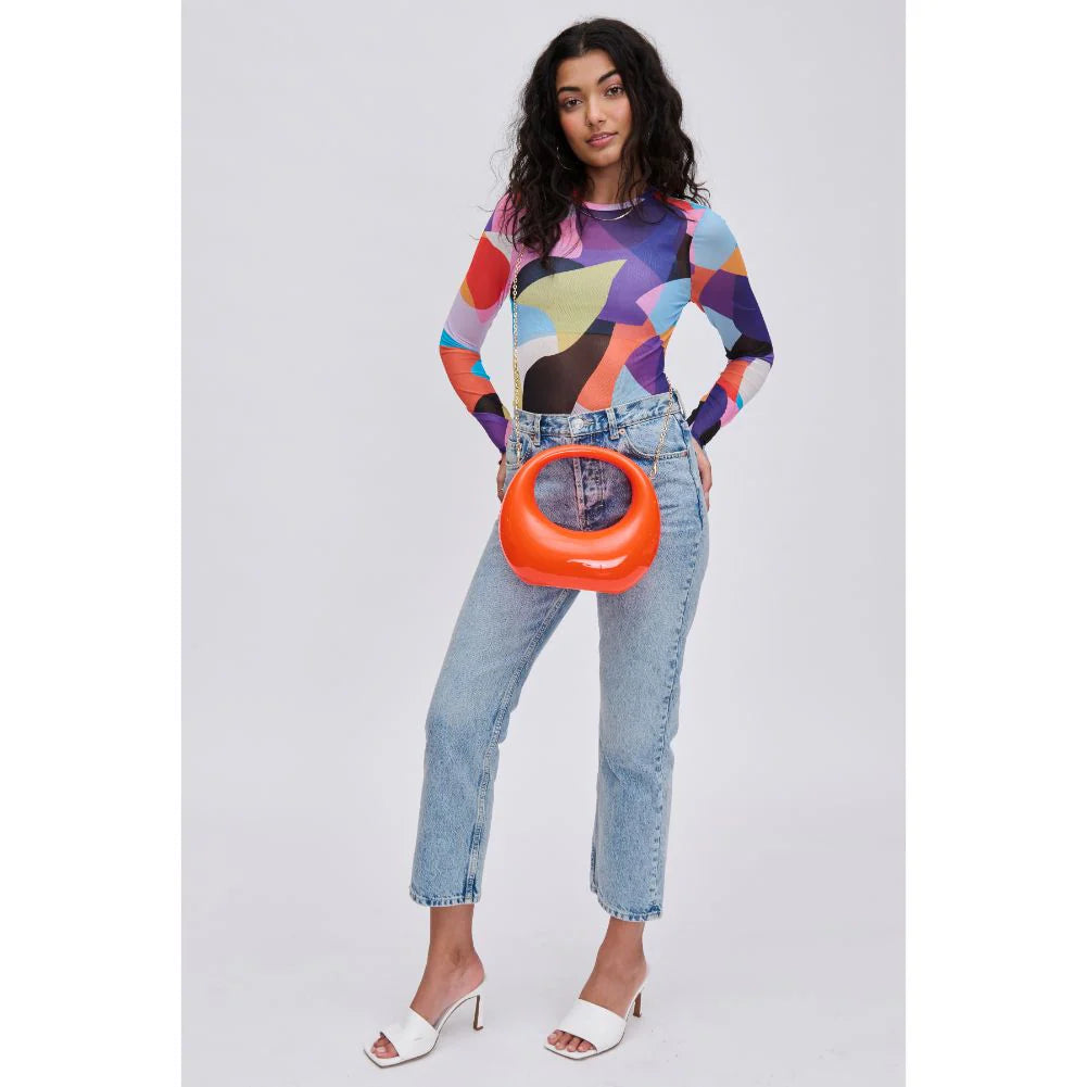 Orange circular acrylic handbag with a gold chain strap model 4