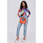 Orange circular acrylic handbag with a gold chain strap model 4