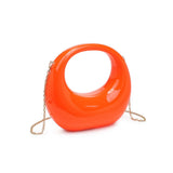 Orange circular acrylic handbag with a gold chain strap alt view