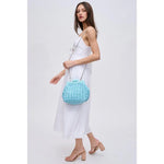 Light blue textured handbag with a chain strap model 3