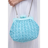 Light blue textured handbag with a chain strap model 4