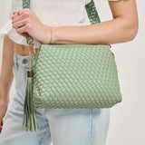 Green textured handbag with a green black and white striped strap model 4