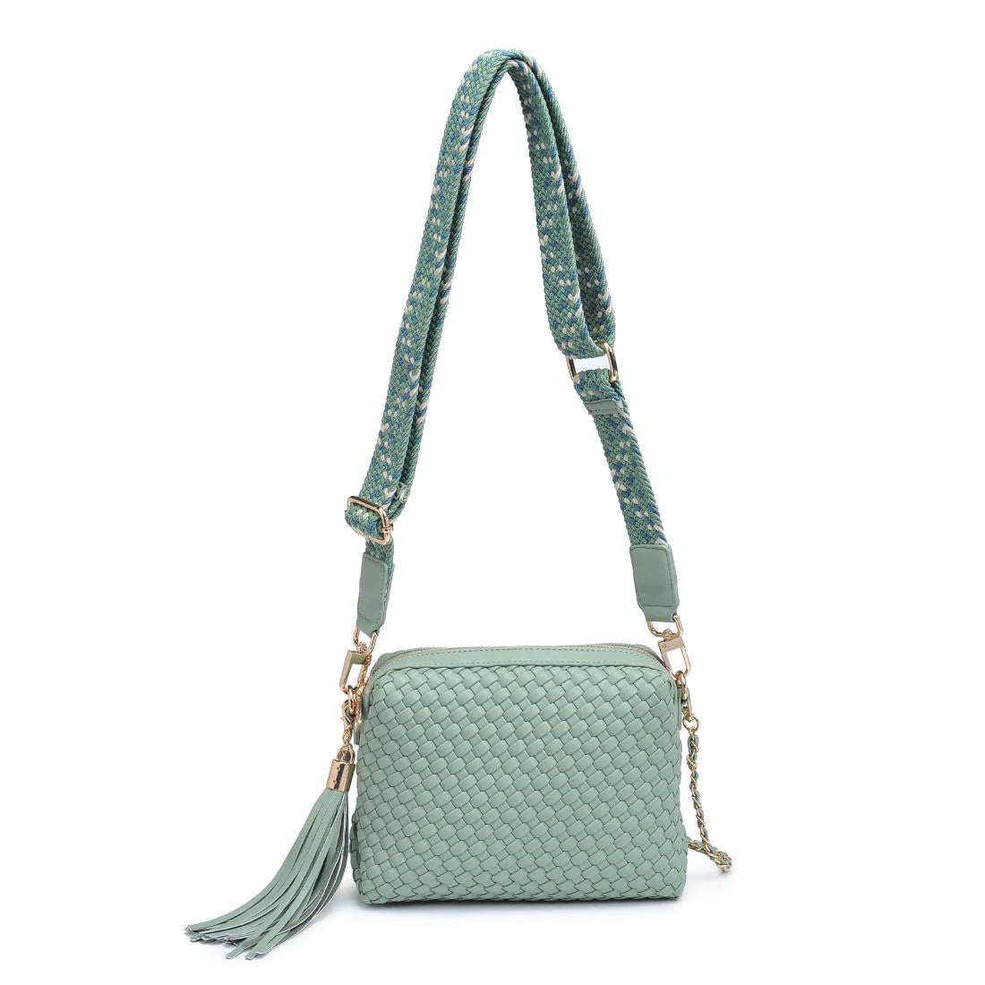 Green textured handbag with a green black and white striped strap