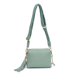 Green textured handbag with a green black and white striped strap
