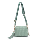 Green textured handbag with a green black and white striped strap