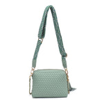 Green textured handbag with a green black and white striped strap back