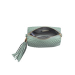 Green textured handbag with a green black and white striped strap opening