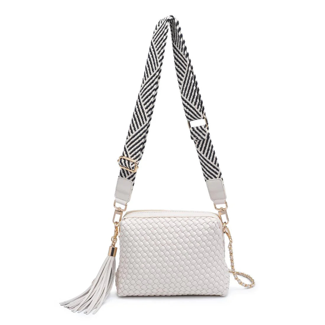 White textured handbag with a black and white striped strap