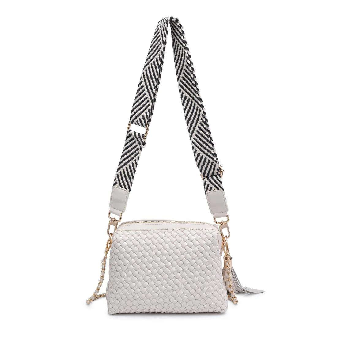 White textured handbag with a black and white striped strap back