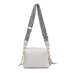White textured handbag with a black and white striped strap back