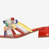 Multicolored heel with bow and red heel inside view