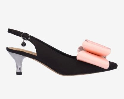 Black high-heeled shoe with pink bow close-up