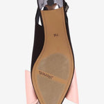 Black high-heeled shoe with pink bow sole