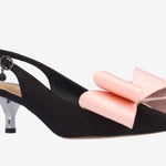 Black high-heeled shoe with pink bow front view