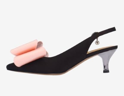 Black high-heeled shoe with pink bow side view