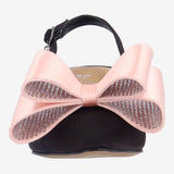 Black high-heeled shoe with pink bow toe box