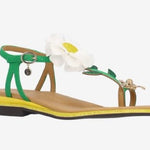 Green sandal with a white flower and yellow heel front view