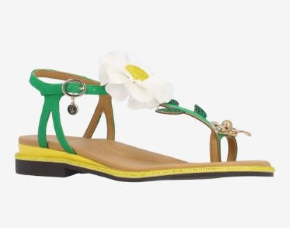 Green sandal with a white flower and yellow heel front view