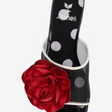 Black heel with a red flower and white/transparent strap top view