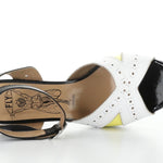 High-heeled platform shoe with checkered heel and yellow/white toe strap top view