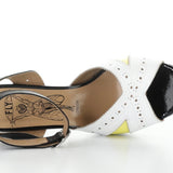 High-heeled platform shoe with checkered heel and yellow/white toe strap top view