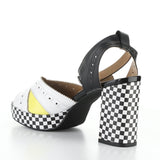 High-heeled platform shoe with checkered heel and yellow/white toe strap inside view