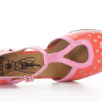 Red polka dot shoe with pink strap and buckle closure top view