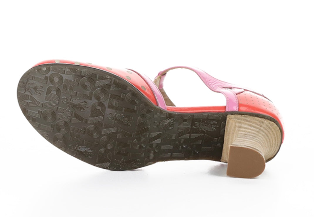 Red polka dot shoe with pink strap and buckle closure sole