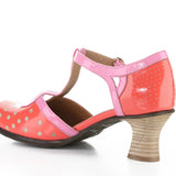 Red polka dot shoe with pink strap and buckle closure inside alternate view