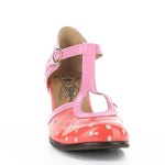 Red polka dot shoe with pink strap and buckle closure toe box