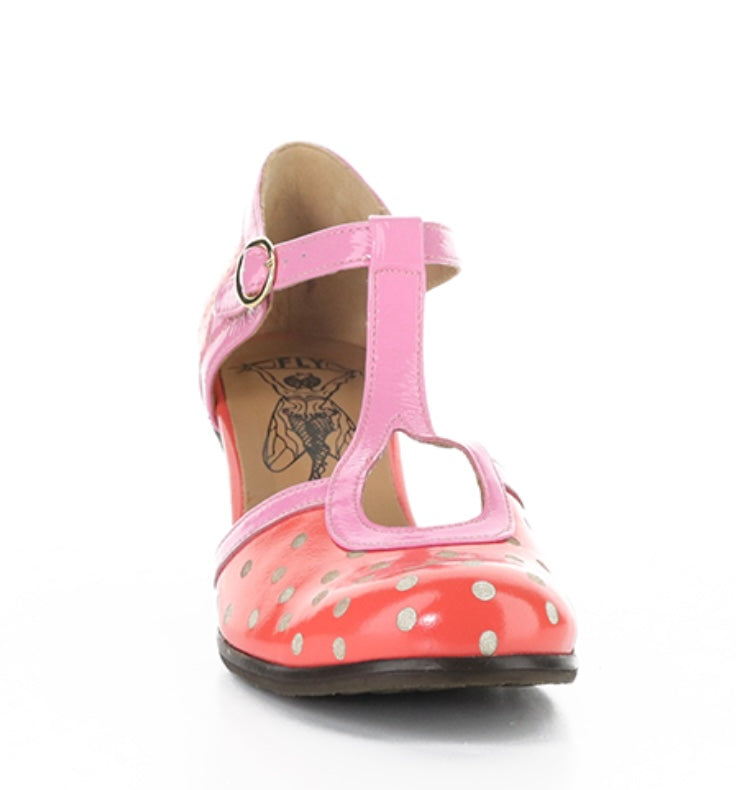 Red polka dot shoe with pink strap and buckle closure toe box