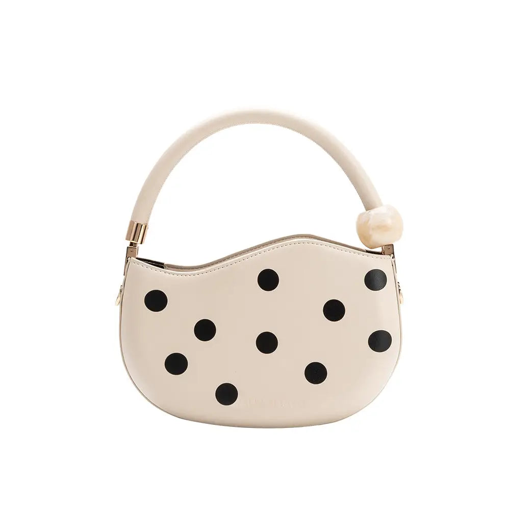 Off-white handbag with black polka dots and pearl handle back