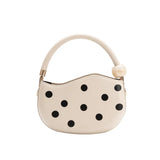 Off-white handbag with black polka dots and pearl handle back