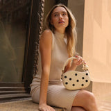 Off-white handbag with black polka dots and pearl handle model