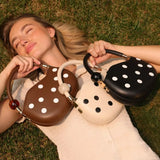 Off-white handbag with black polka dots and pearl handle model all bags
