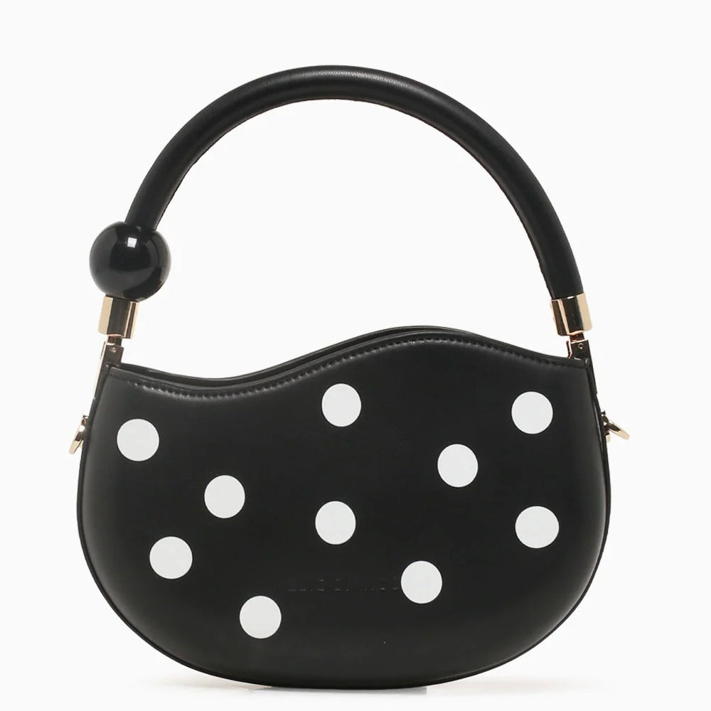 Black round handbag with white polka dots