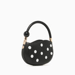 Black round handbag with white polka dots alt view