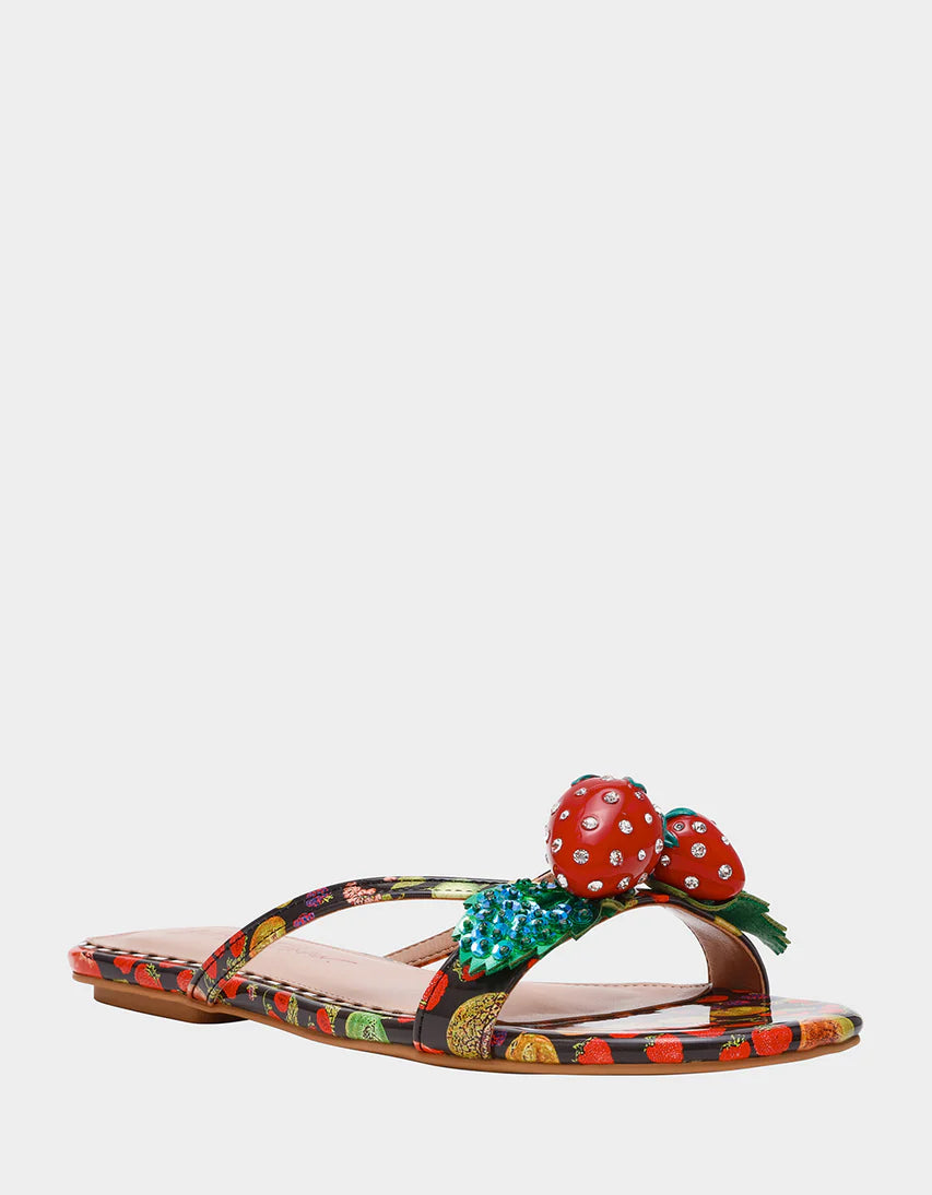 Colorful sandal with a decorative strawberry on toe strap front view