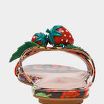 Colorful sandal with a decorative strawberry on toe strap heel view