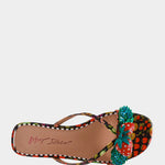 Colorful sandal with a decorative strawberry on toe strap top view