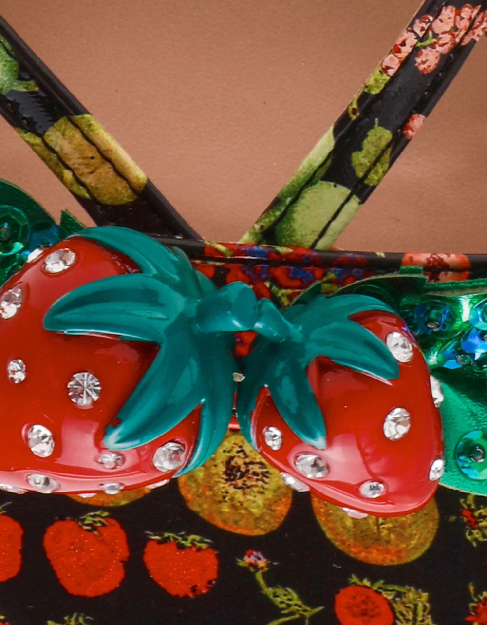 Colorful sandal with a decorative strawberry on toe strap detail